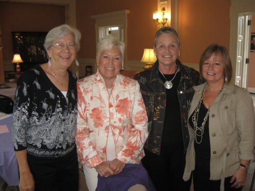 (L to R) Auxiliary officers Melanie Esselman, Treasurer and Shirley Romine, President pause after the meeting for a picture with Actives Mary Catherine Lotti and Debbie Dewees.